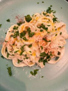 Creamy pasta dish prepared by a private chef