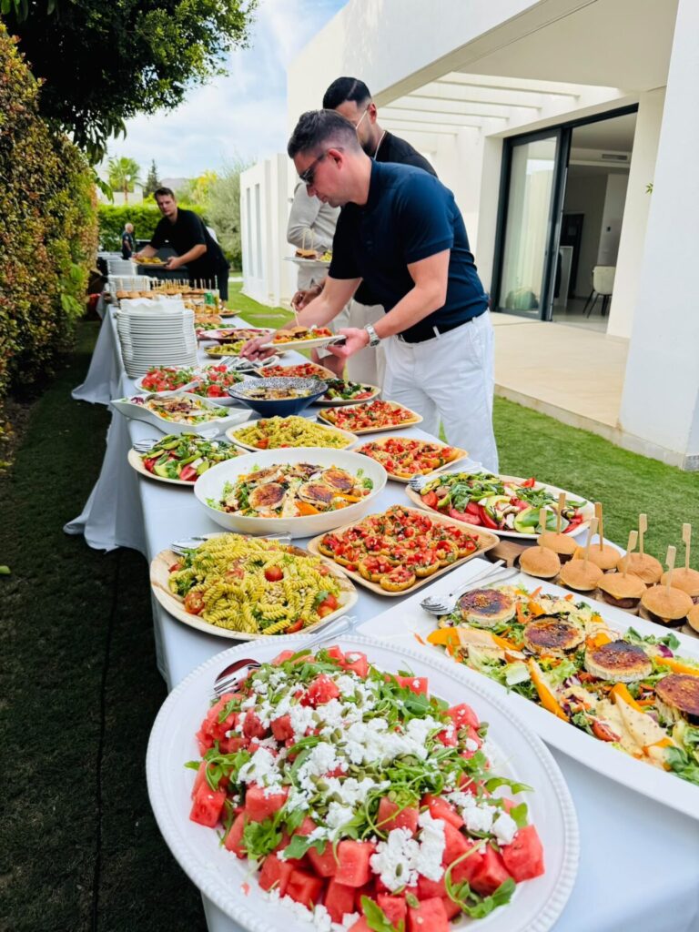 Private chef setting up a buffet at a villa in Marbella